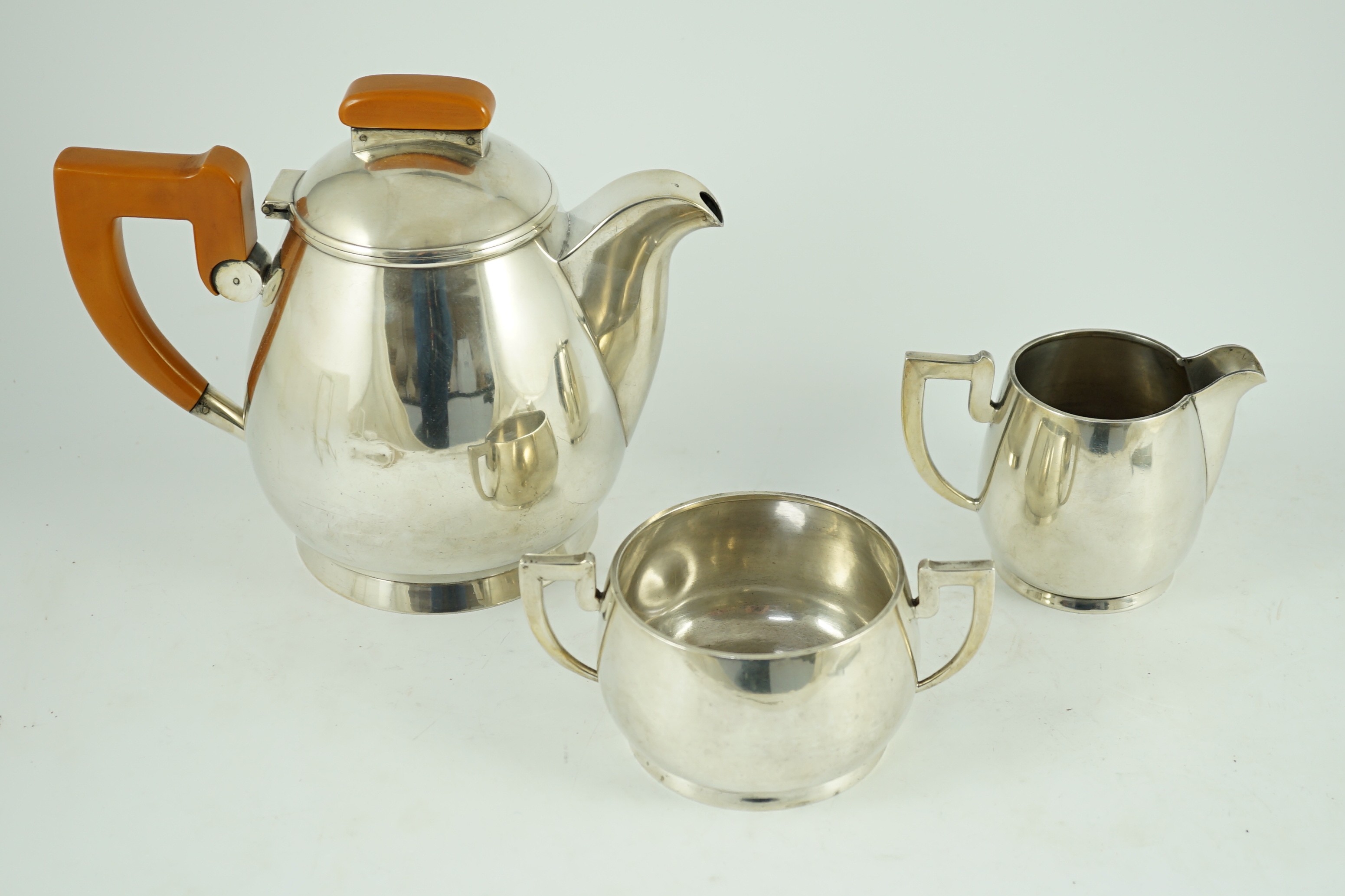 A stylish George VI silver three piece tea set, by Ls Sl